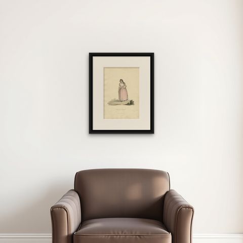 Antique Costume Print of a Dutch Woman from Broek in Waterland, 1817, shown framed on a wall