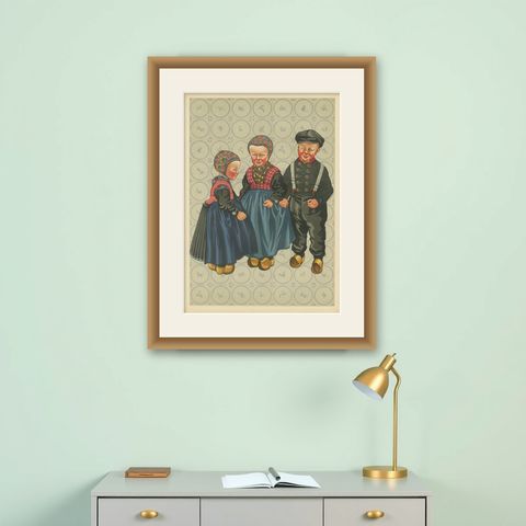 Dutch Children in Traditional Staphorst Dress with Delfts Blue Tile Background, shown framed on a wall