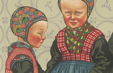 Dutch Children in Traditional Staphorst Dress with Delfts Blue Tile Background, close-up 3